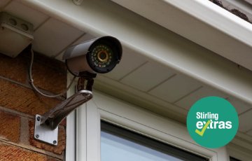 Image of security camera on the eaves of a house